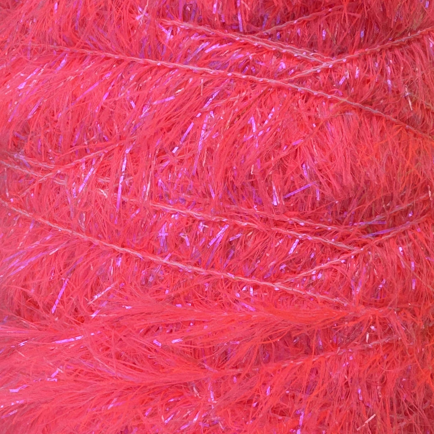 Upavon UV Boosted Straggle Hackle in bright orange, fly tying materials by UPAVON FLY FISHING, showing 4mm UV-enhanced hackle fibers