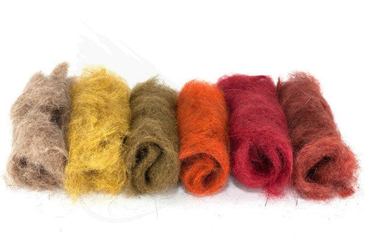 Close-up of Troutline Mad Rabbit Dubbing fly tying material in natural brown, showing the soft, textured fur for fly creation.