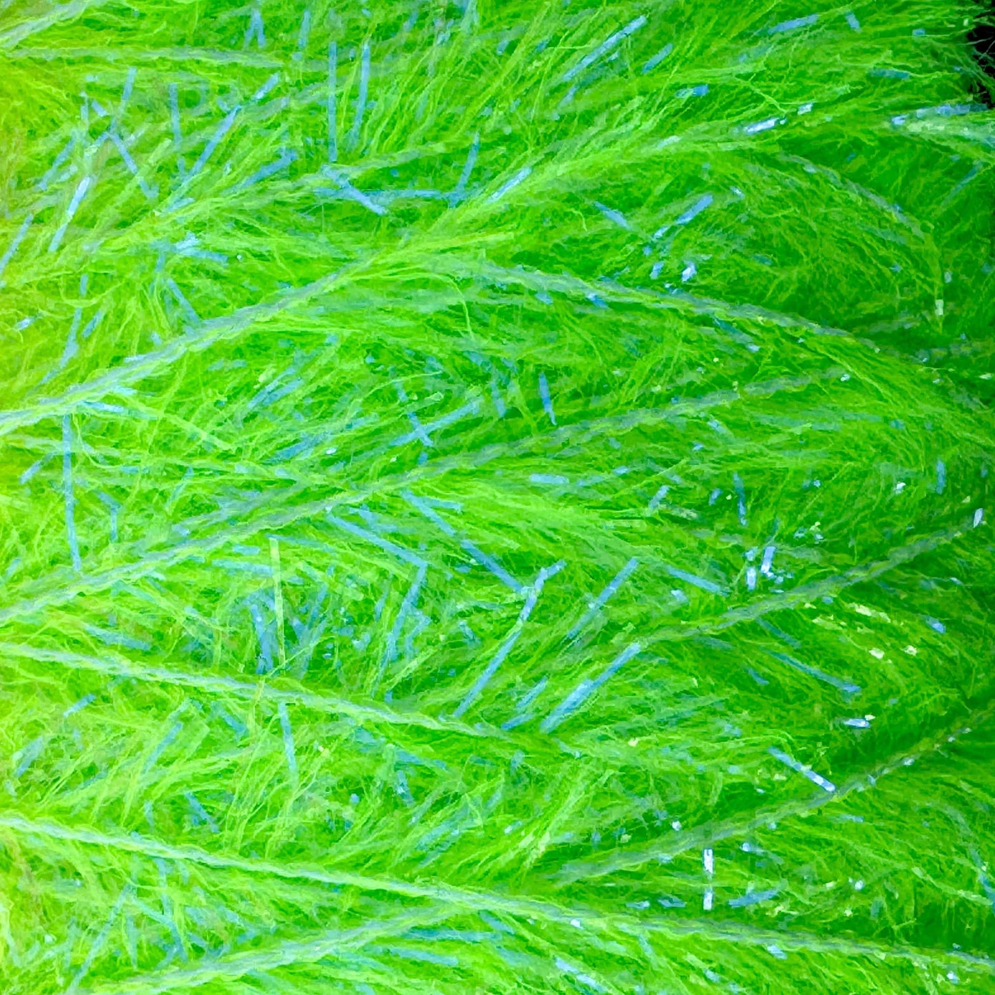 Upavon UV Boosted Straggle Hackle in bright orange, fly tying material by UPAVON FLY FISHING, with 4mm UV-boosted hackle fibers.