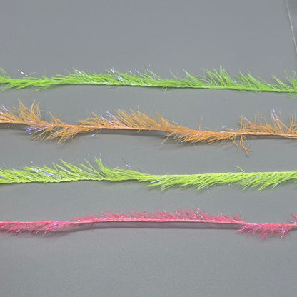Upavon UV Boosted Straggle Hackle in UV orange, fly tying materials by UPAVON FLY FISHING, showing 4mm UV hackle fibers