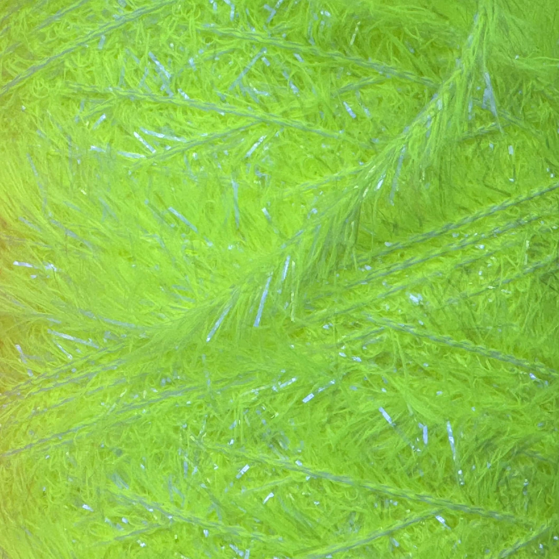 Upavon UV Boosted Straggle Hackle in bright orange for fly tying, made by UPAVON FLY FISHING, showcasing flexible UV-boosted hackle fibers.
