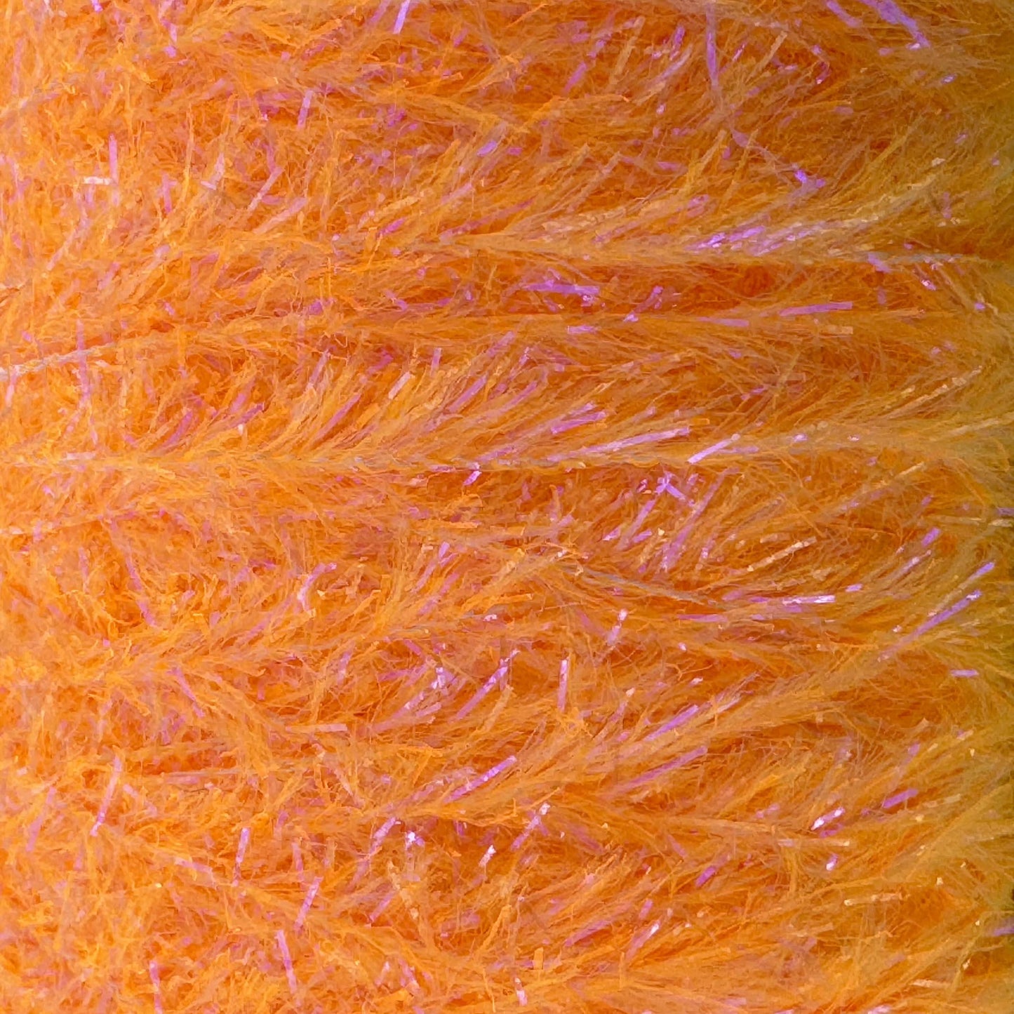 Upavon UV Boosted Straggle Hackle in bright orange, fly tying material by UPAVON FLY FISHING, 4mm UV-enhanced hackle for fishing flies.